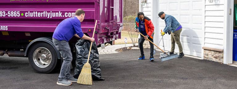 People cleaning up after junk removal